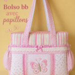 Sac à dos pour bébé avec des motifs de papillons colorés, idéal pour le transport en voiture.