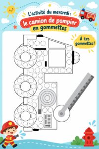 Un camion de pompier coloré fait de gommettes présenté sur une table, illustrant une activité manuelle pour enfants.
